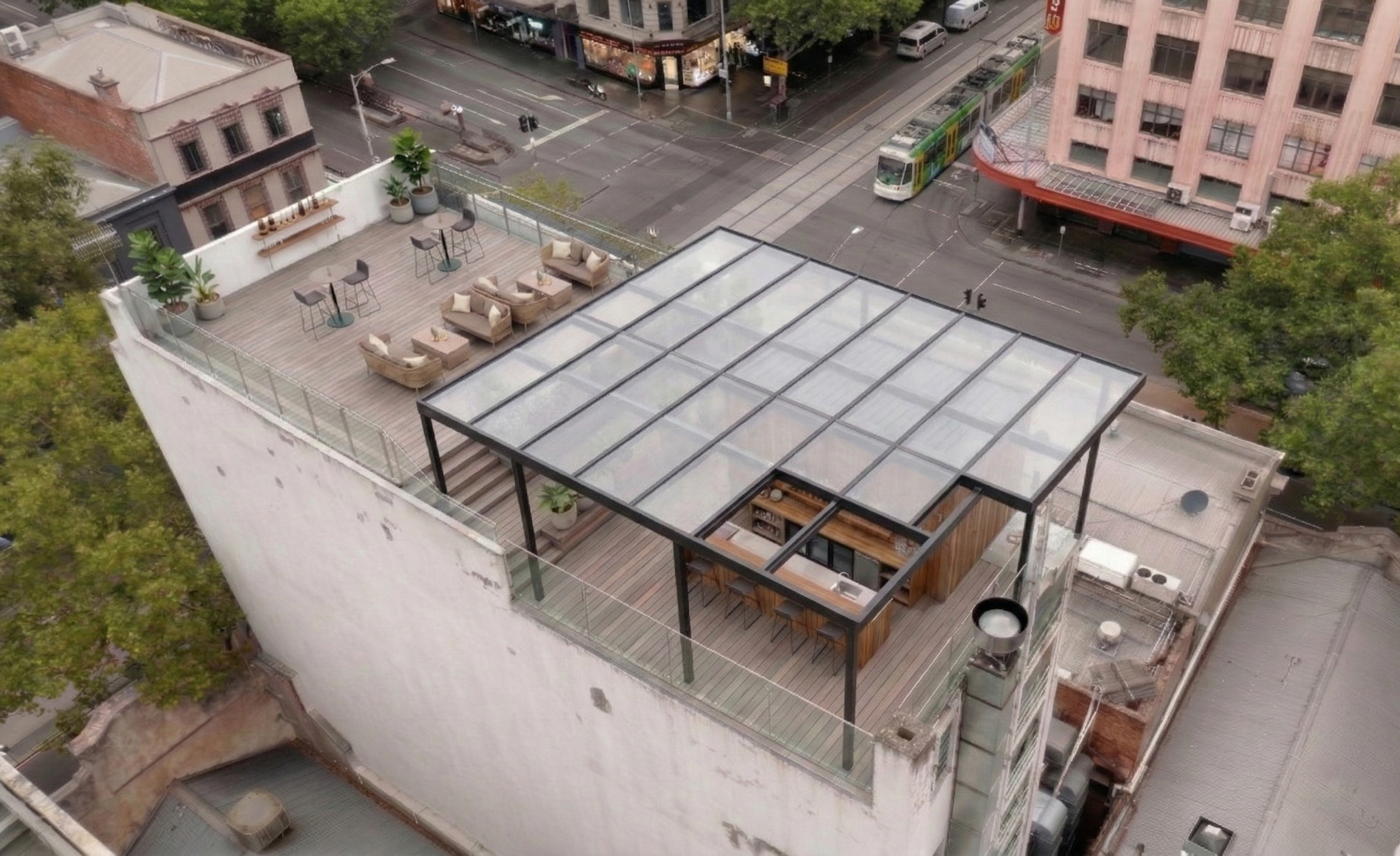 Rooftop layout with glass-covered bar area for hospitality venue